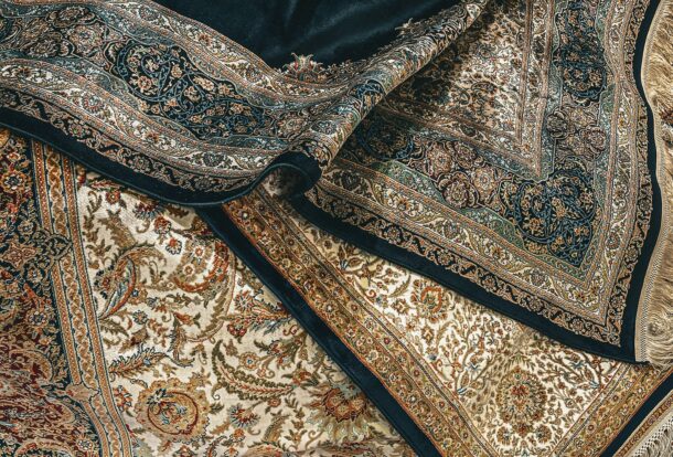 Close-up of luxurious handmade Oriental rugs with intricate patterns and rich colors, ideal for professional rug cleaning and restoration services in Dallas-Fort Worth