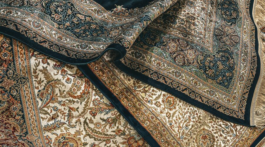 Close-up of luxurious handmade Oriental rugs with intricate patterns and rich colors, ideal for professional rug cleaning and restoration services in Dallas-Fort Worth